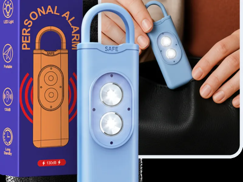 Blue HerAlarm personal alarm next to its retail box
